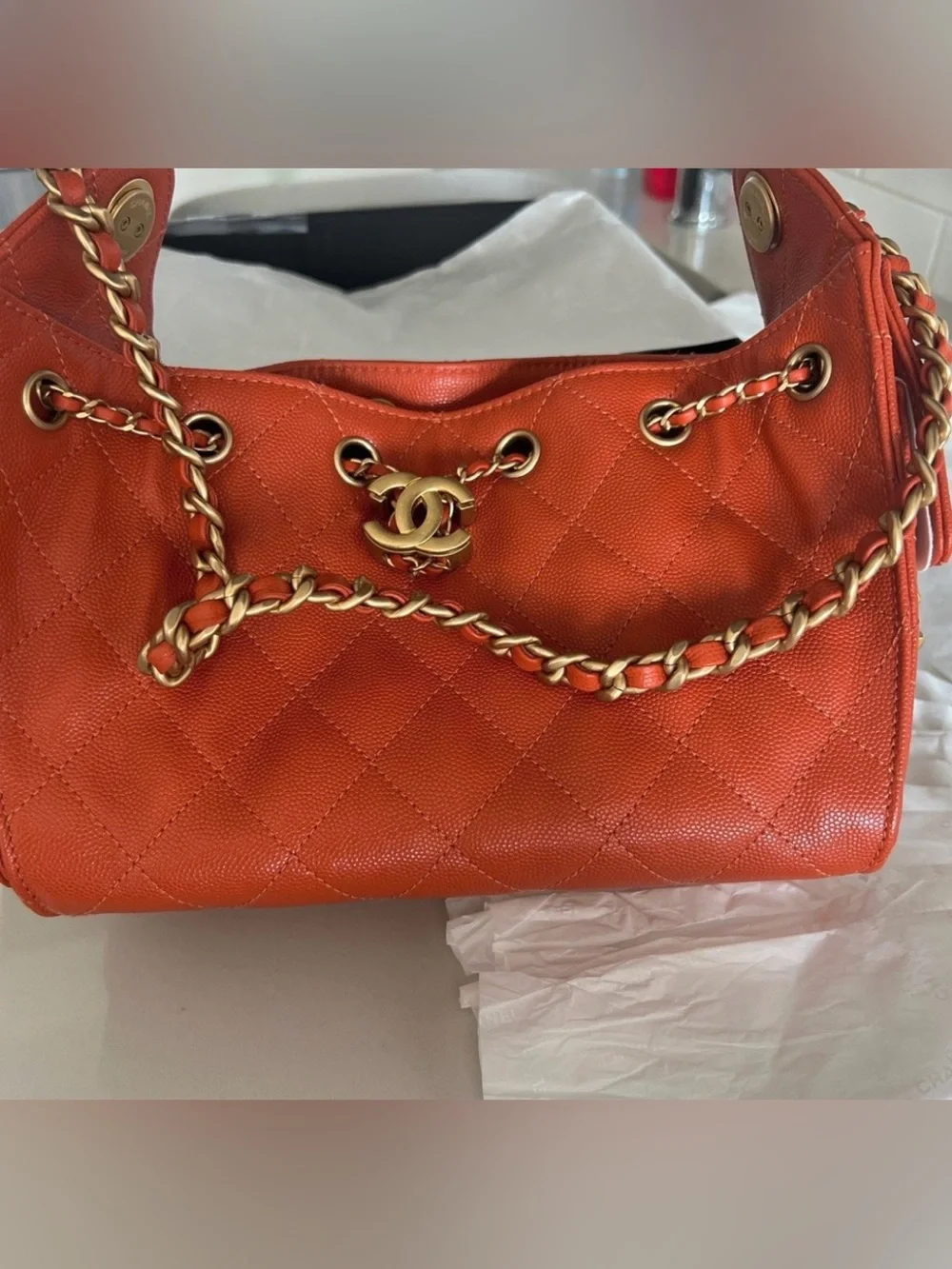 CHANEL Orange Quilted Drawstring Shoulder Bag with Gold Chain